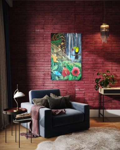 Gemütliche Sitzecke mit blauem Sessel, Tisch, Pflanze und buntem Kunstwerk an der Wand.