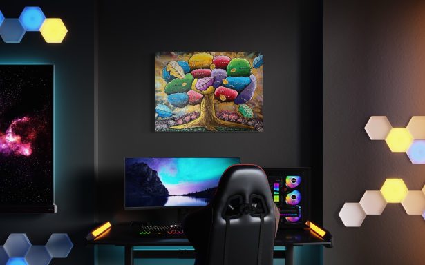 Ein moderner Schreibtisch mit Computer und buntem Kunstwerk an der Wand.
